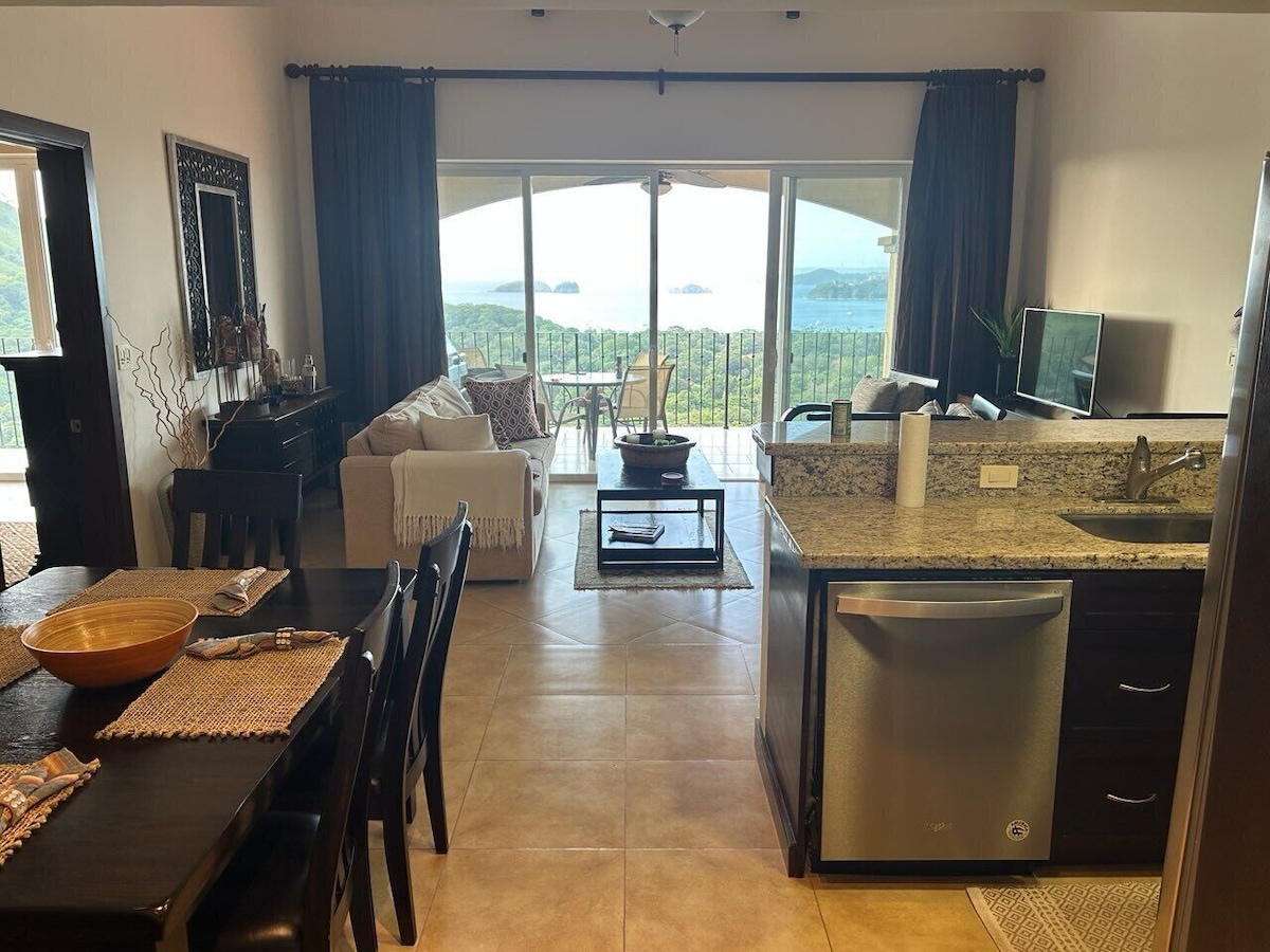 A402 living room opening to Bay of Papagayo and ocean views