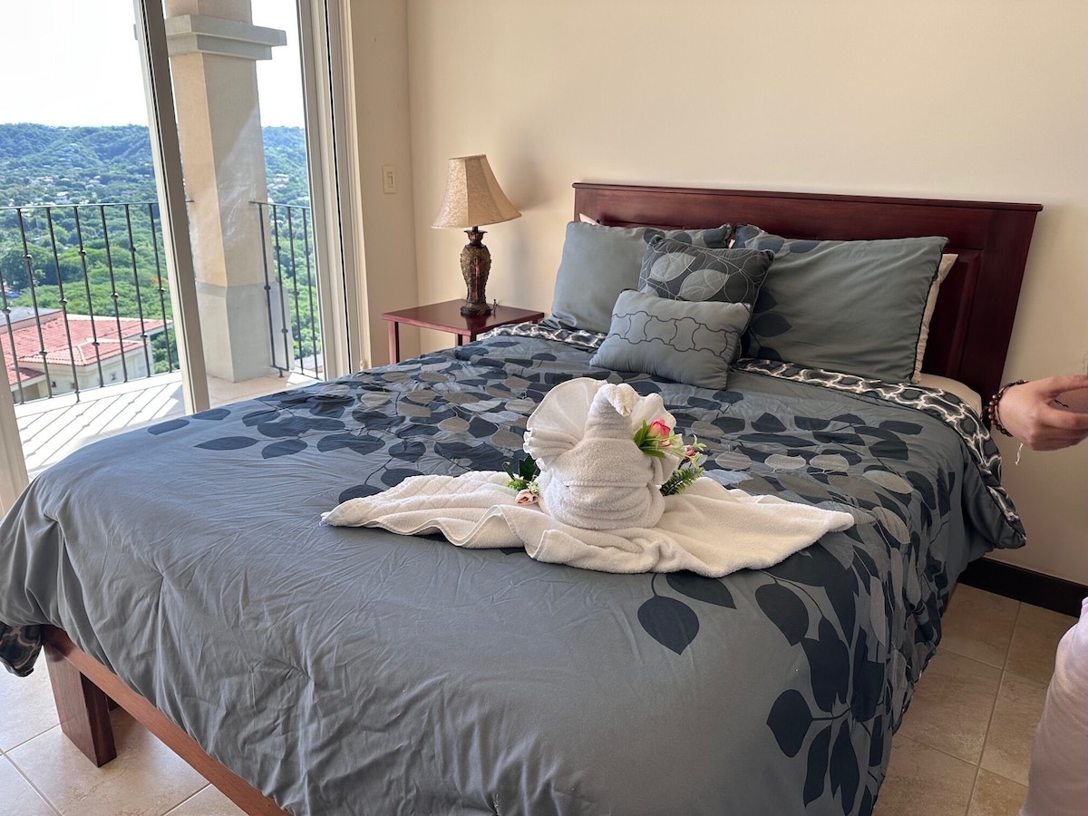E201 bedroom with hillside balcony view